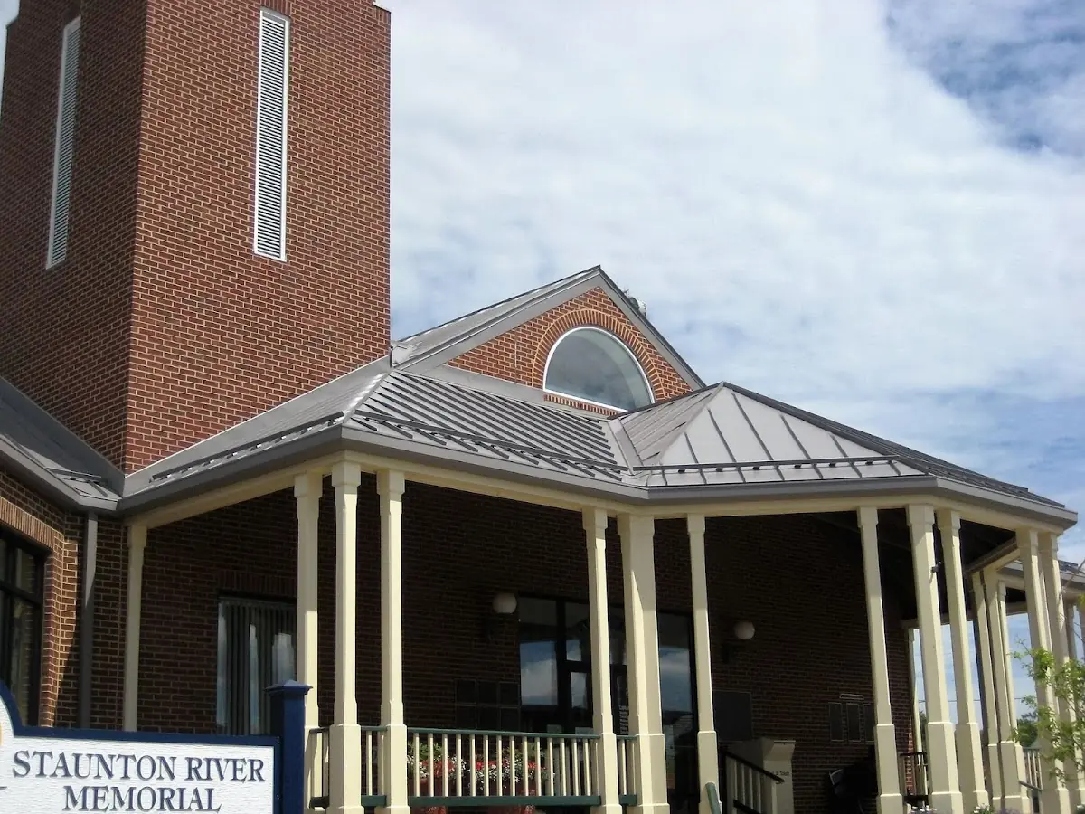 Skilled roofing craftsmen working on a residential roof in Goldsboro